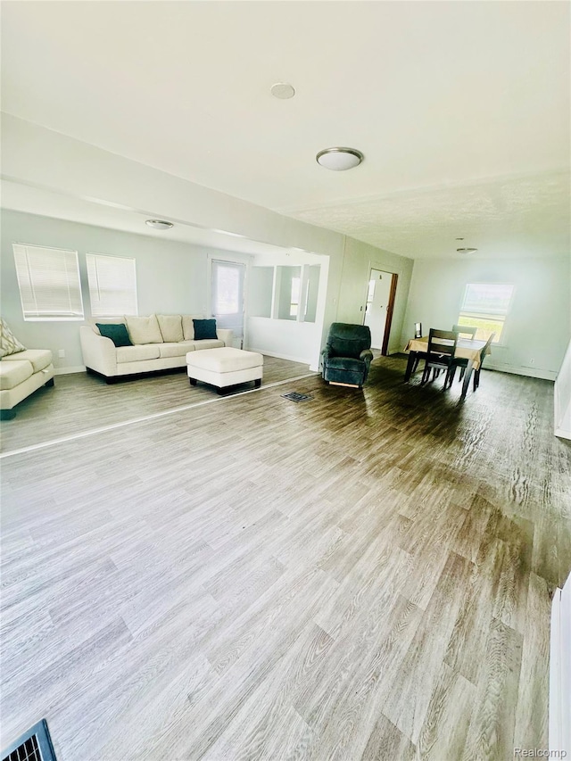 6196 W Plains Rd, Eaton Rapids, MI 48827 - living room featuring wood finished floors and baseboards