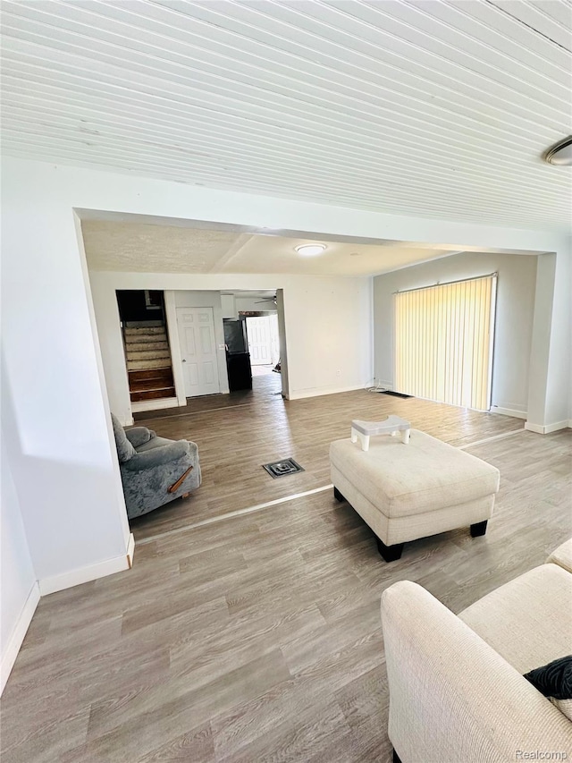6196 W Plains Rd, Eaton Rapids, MI 48827 - living room featuring baseboards and wood finished floors