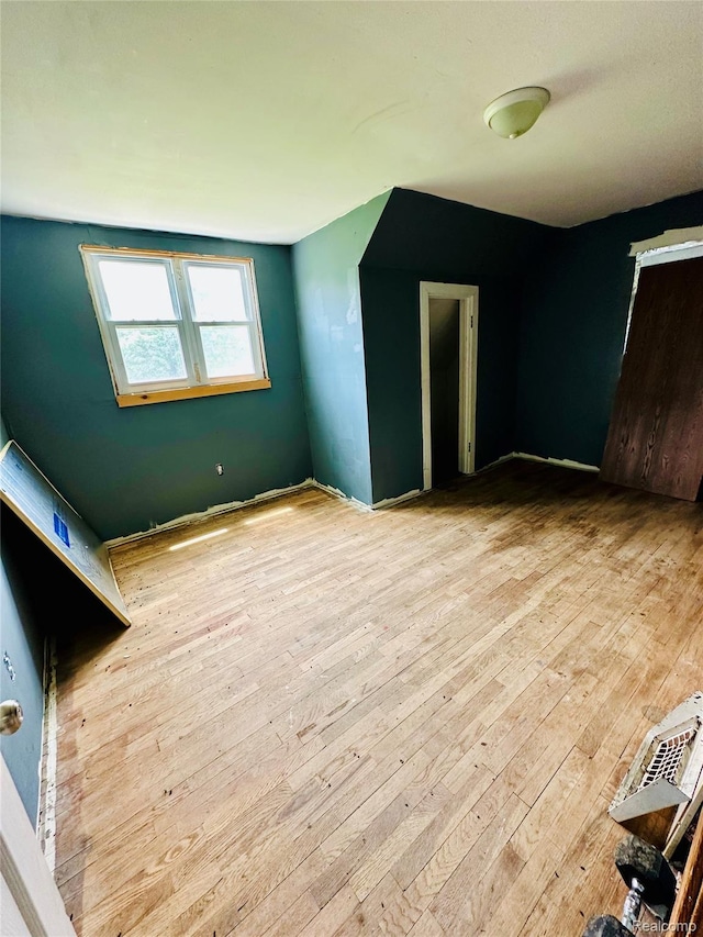 6196 W Plains Rd, Eaton Rapids, MI 48827 - unfurnished bedroom featuring hardwood / wood-style floors