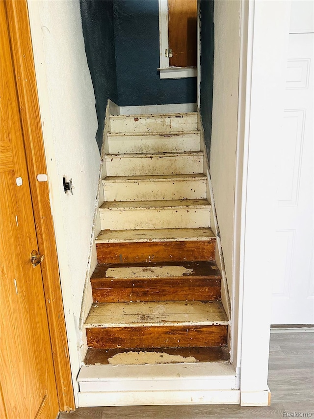 6196 W Plains Rd, Eaton Rapids, MI 48827 - staircase with wood finished floors