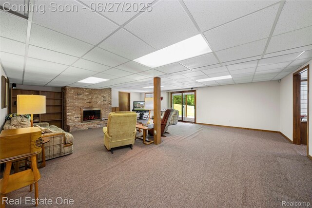 1145 W Moore Rd, Milford, MI 48381 - carpeted living room with a drop ceiling, a brick fireplace, and built in features