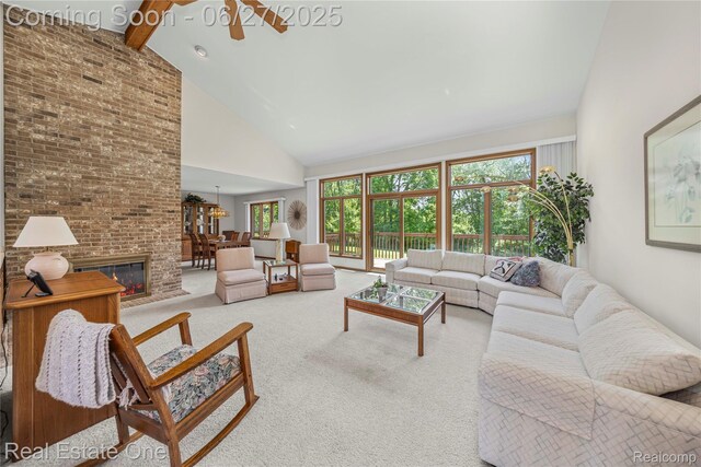 1145 W Moore Rd, Milford, MI 48381 - carpeted living room with high vaulted ceiling, plenty of natural light, beamed ceiling, and a chandelier