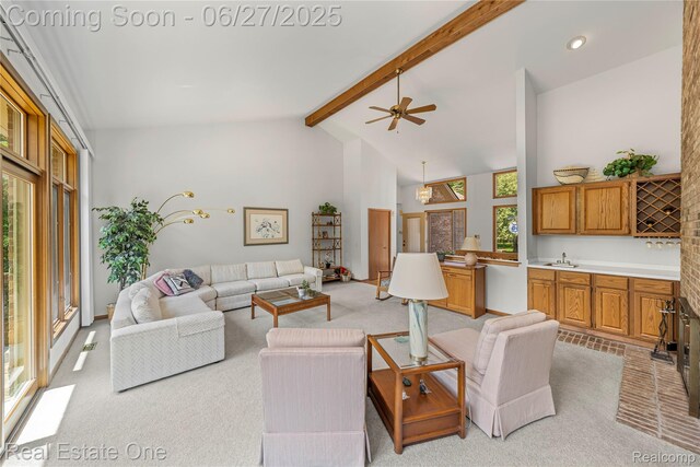1145 W Moore Rd, Milford, MI 48381 - living area with beamed ceiling, light colored carpet, a ceiling fan, high vaulted ceiling, and recessed lighting