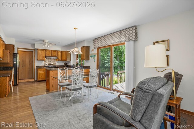 1145 W Moore Rd, Milford, MI 48381 - dining area with light wood-style floors and a ceiling fan
