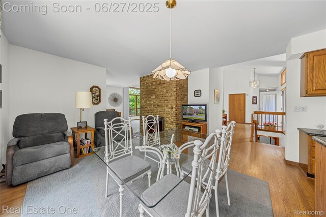 1145 W Moore Rd, Milford, MI 48381 - dining room featuring wood finished floors