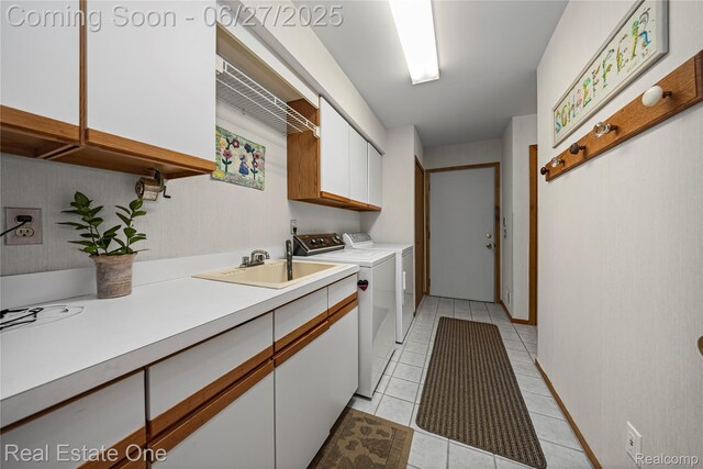 1145 W Moore Rd, Milford, MI 48381 - laundry room featuring cabinet space, washer and dryer, and light tile patterned floors