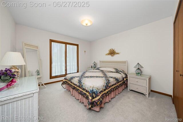 1145 W Moore Rd, Milford, MI 48381 - bedroom with light carpet and baseboards