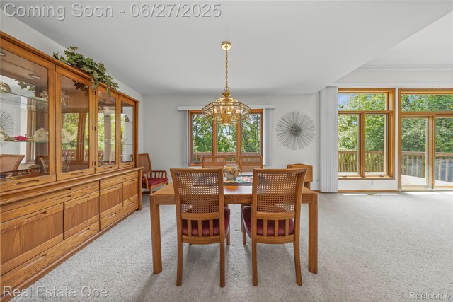 1145 W Moore Rd, Milford, MI 48381 - dining area featuring light carpet and a chandelier