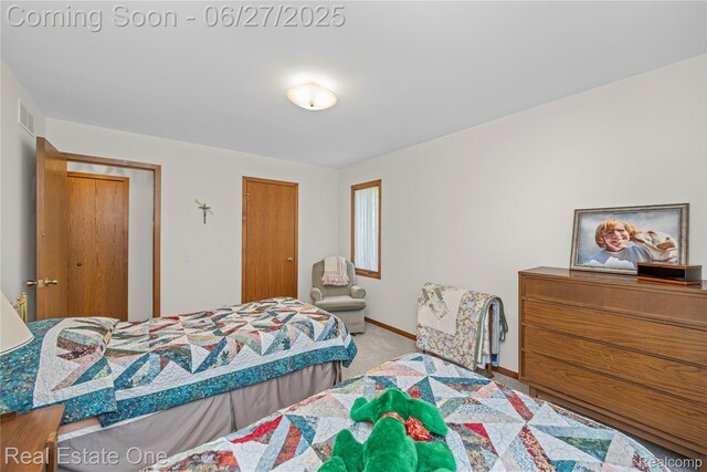 1145 W Moore Rd, Milford, MI 48381 - bedroom with carpet and baseboards