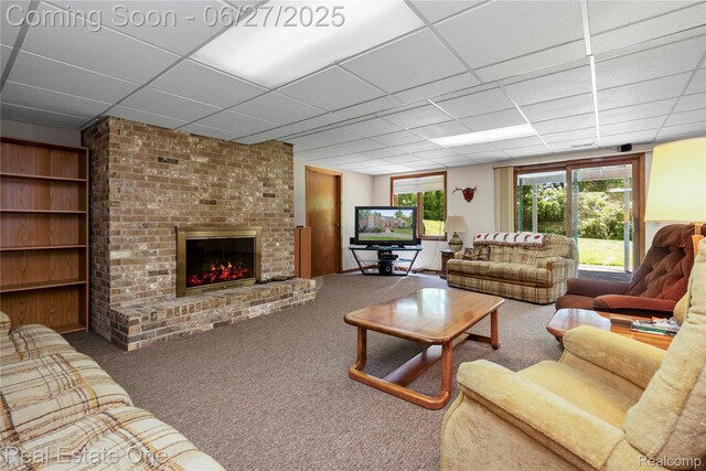 1145 W Moore Rd, Milford, MI 48381 - living room with a drop ceiling, carpet floors, and a brick fireplace