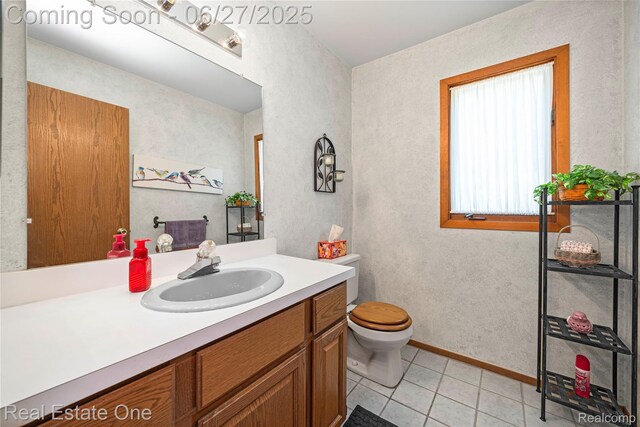 1145 W Moore Rd, Milford, MI 48381 - bathroom with vanity and tile patterned floors