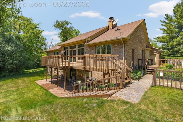 1145 W Moore Rd, Milford, MI 48381 - back of property featuring a deck, a patio, brick siding, and a lawn