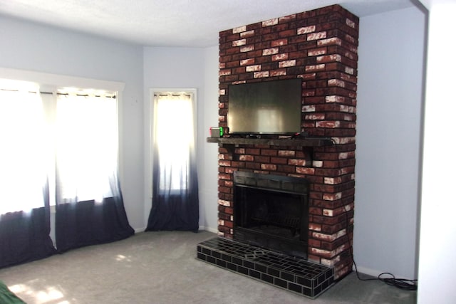 602 Fairview Ave, Manistee, MI 49660 - unfurnished living room with carpet flooring and a brick fireplace