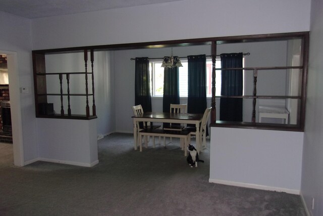 602 Fairview Ave, Manistee, MI 49660 - carpeted dining space with baseboards