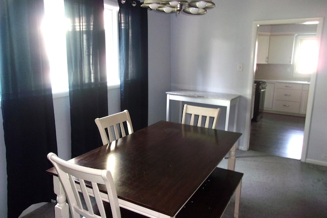 602 Fairview Ave, Manistee, MI 49660 - dining space with a chandelier and light colored carpet