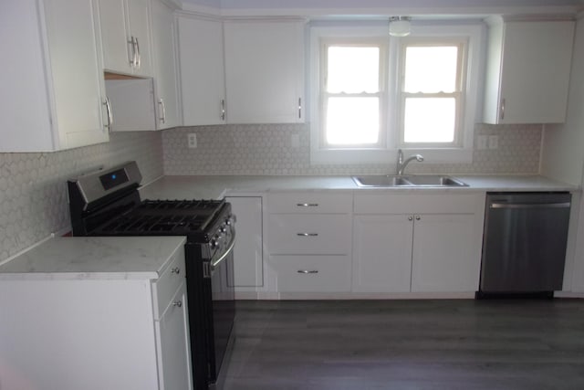 602 Fairview Ave, Manistee, MI 49660 - kitchen featuring appliances with stainless steel finishes, a sink, and white cabinetry
