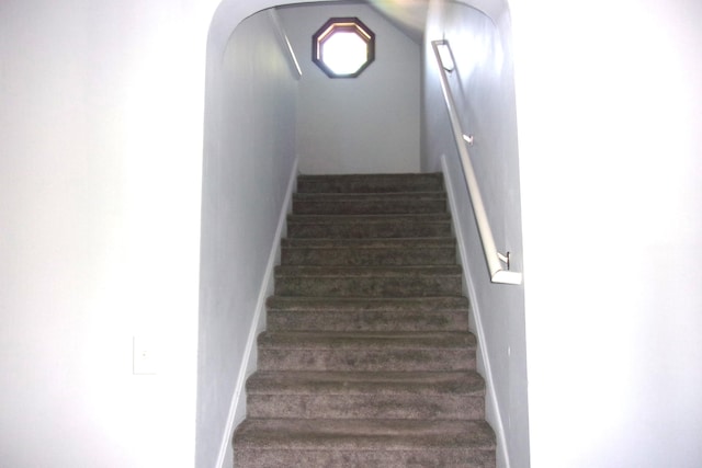 602 Fairview Ave, Manistee, MI 49660 - stairway with baseboards and wood finished floors