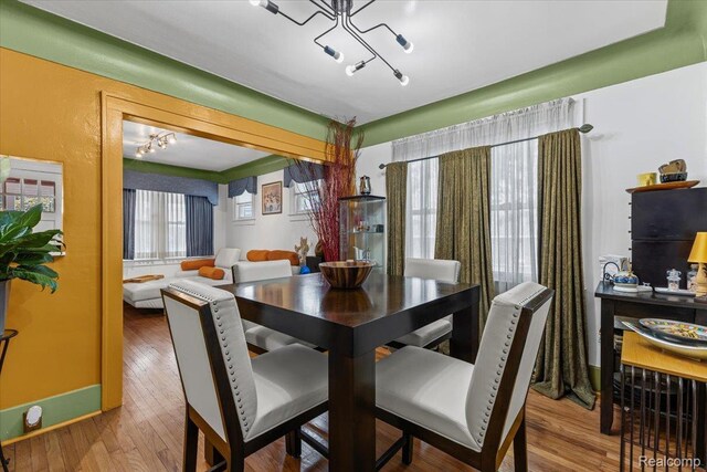 809 E Bennett Ave, Ferndale, MI 48220 - dining space with a chandelier and wood finished floors