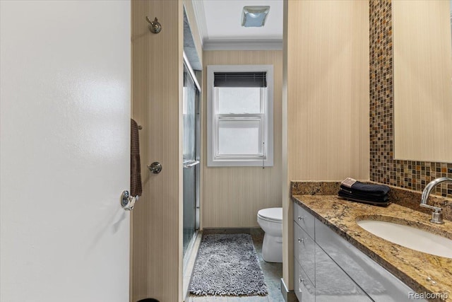 809 E Bennett Ave, Ferndale, MI 48220 - bathroom featuring vanity, toilet, a shower stall, crown molding, and backsplash