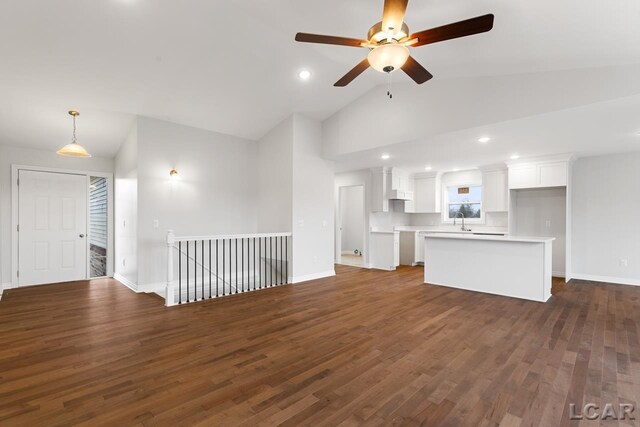 2819 Eunice Cir, Adrian, MI 49221 - unfurnished living room featuring a sink, ceiling fan, dark wood-style flooring, baseboards, and recessed lighting