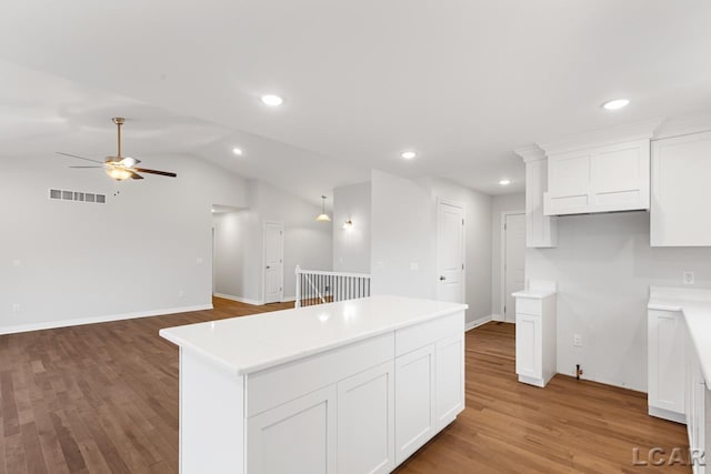 2819 Eunice Cir, Adrian, MI 49221 - kitchen with a center island, a ceiling fan, white cabinetry, light wood-style flooring, and recessed lighting