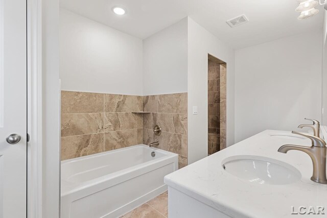 2819 Eunice Cir, Adrian, MI 49221 - full bathroom with a bath, double vanity, and tile patterned floors