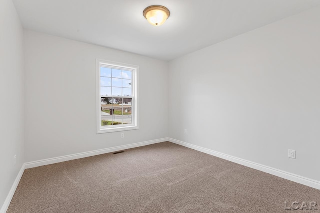 2819 Eunice Cir, Adrian, MI 49221 - carpeted empty room featuring baseboards