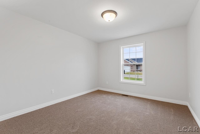 2819 Eunice Cir, Adrian, MI 49221 - carpeted spare room with baseboards