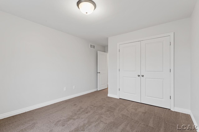 2819 Eunice Cir, Adrian, MI 49221 - unfurnished bedroom with carpet floors, a closet, and baseboards