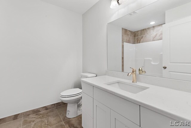 2819 Eunice Cir, Adrian, MI 49221 - full bathroom with toilet, vanity, and a shower