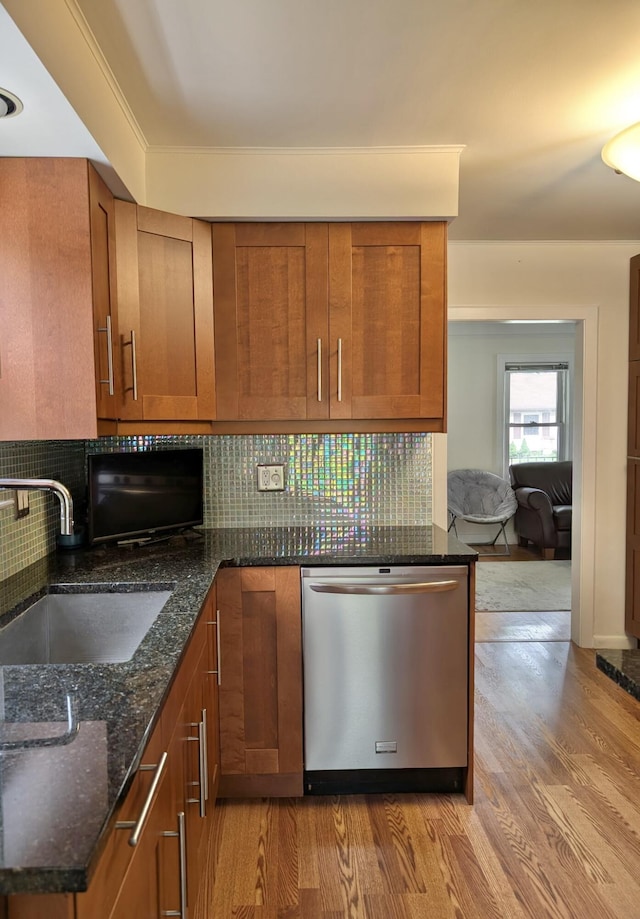 26314 E St, Saint Clair Shores, MI 48081 - kitchen featuring stainless steel dishwasher, a sink, light wood-type flooring, and brown cabinetry