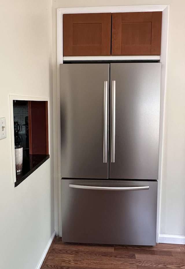 26314 E St, Saint Clair Shores, MI 48081 - kitchen view of freestanding refrigerator, dark wood finished floors, and baseboards