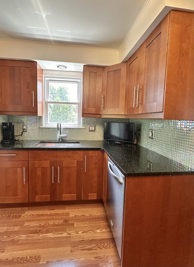 26314 E St, Saint Clair Shores, MI 48081 - kitchen with a sink, stainless steel dishwasher, brown cabinets, light wood-style floors, and dark stone countertops