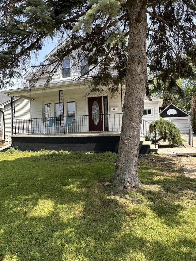 26314 E St, Saint Clair Shores, MI 48081 - view of front of property with a porch, a front yard, and a garage
