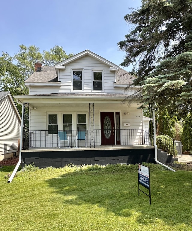 26314 E St, Saint Clair Shores, MI 48081 - view of front of house with covered porch, roof with shingles, a chimney, and a front lawn