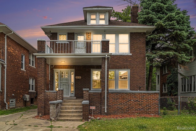 74 W Dakota, Highland Park, MI 48203 - view of front of home with a balcony, a chimney, brick siding, and covered porch