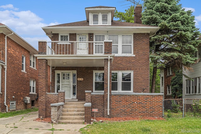 74 W Dakota, Highland Park, MI 48203 - view of front facade with a balcony, a chimney, and brick siding