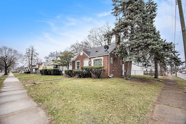 20265 Yonka St, Detroit, MI 48234 - view of property exterior featuring brick siding, a chimney, and a residential view