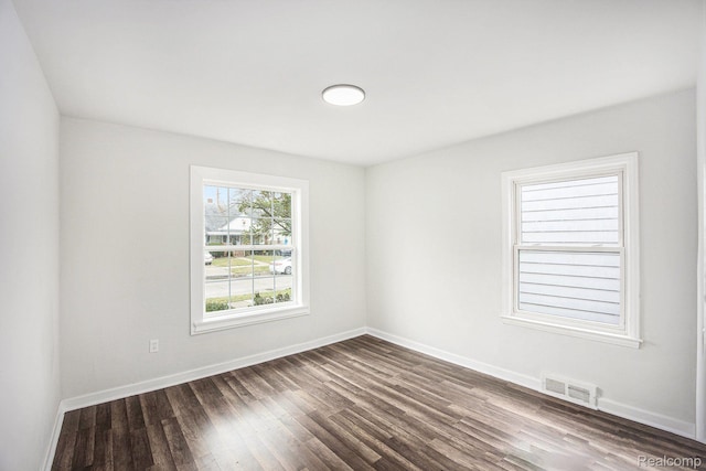 20265 Yonka St, Detroit, MI 48234 - spare room with dark wood-style flooring and baseboards