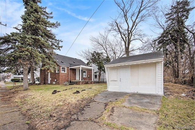 20265 Yonka St, Detroit, MI 48234 - view of front of home featuring an outdoor structure and brick siding