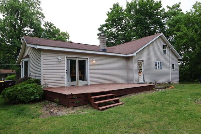 113 S Park St, Union City, MI 49094 - back of house featuring a wooden deck, a chimney, and a lawn