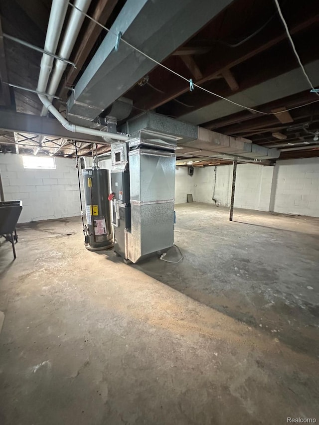 2825 Raskob St, Flint, MI 48504 - unfinished basement with gas water heater and heating unit