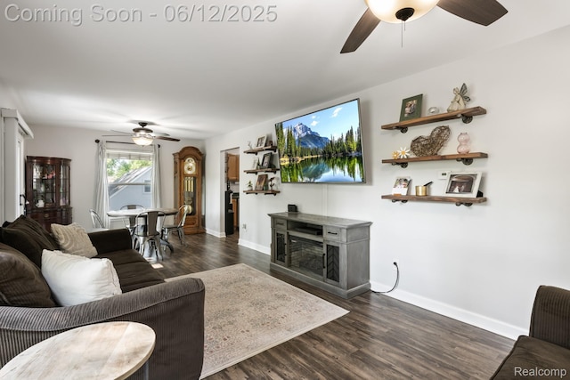 6287 Woodring Ct, Brighton, MI 48116 - living room with ceiling fan, dark wood-style floors, and baseboards