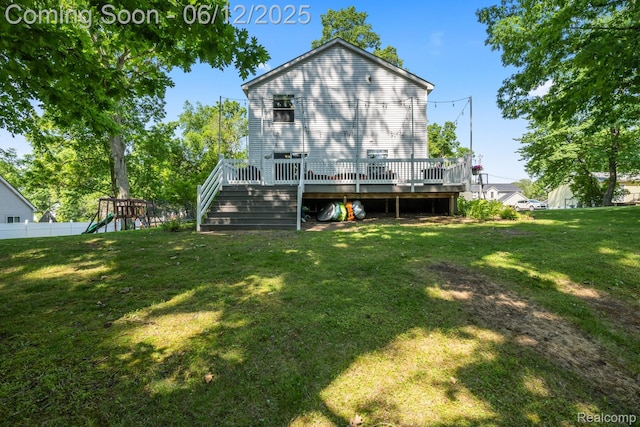 6287 Woodring Ct, Brighton, MI 48116 - back of property featuring a playground, a wooden deck, and stairs