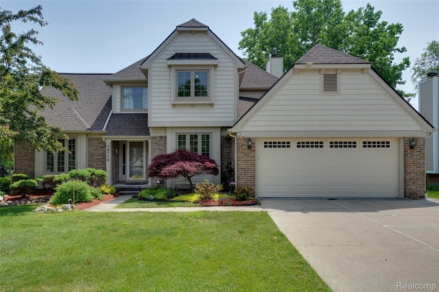 39719 Squire Rd, Novi, MI 48375 - view of front facade featuring brick siding, roof with shingles, concrete driveway, and an attached garage