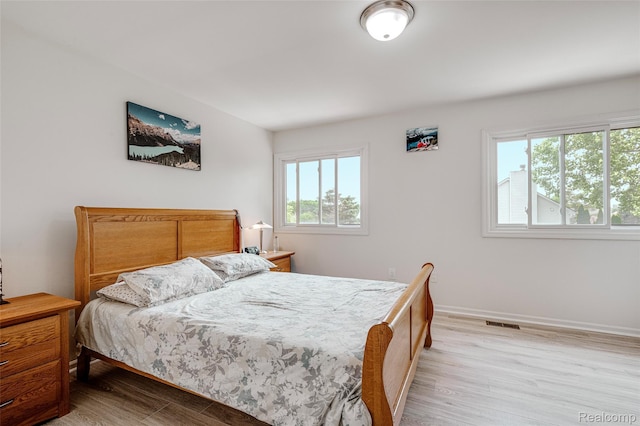 39719 Squire Rd, Novi, MI 48375 - bedroom with light wood-style floors and baseboards