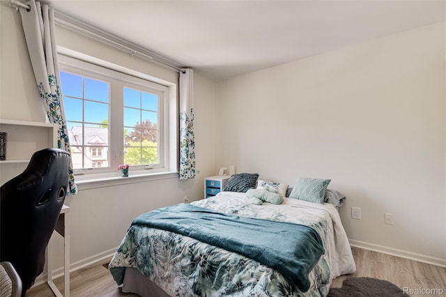 39719 Squire Rd, Novi, MI 48375 - bedroom with baseboards and wood finished floors