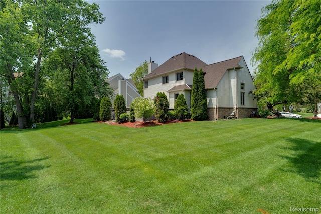 39719 Squire Rd, Novi, MI 48375 - view of front facade featuring a chimney and a front lawn