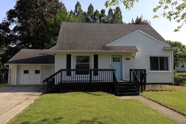 600 Center Dr, Tecumseh, MI 49286 - view of front facade with an attached garage, a front yard, concrete driveway, and a shingled roof