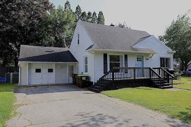 600 Center Dr, Tecumseh, MI 49286 - view of front of home with driveway, roof with shingles, and an attached garage